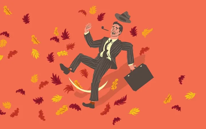 Cartoon of suited office worker slipping backward amid falling leaves, briefcase in hand and hat tossed in air