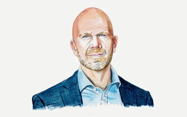 Illustrated portrait of a bald man in a blue blazer and open-collar shirt, smiling.