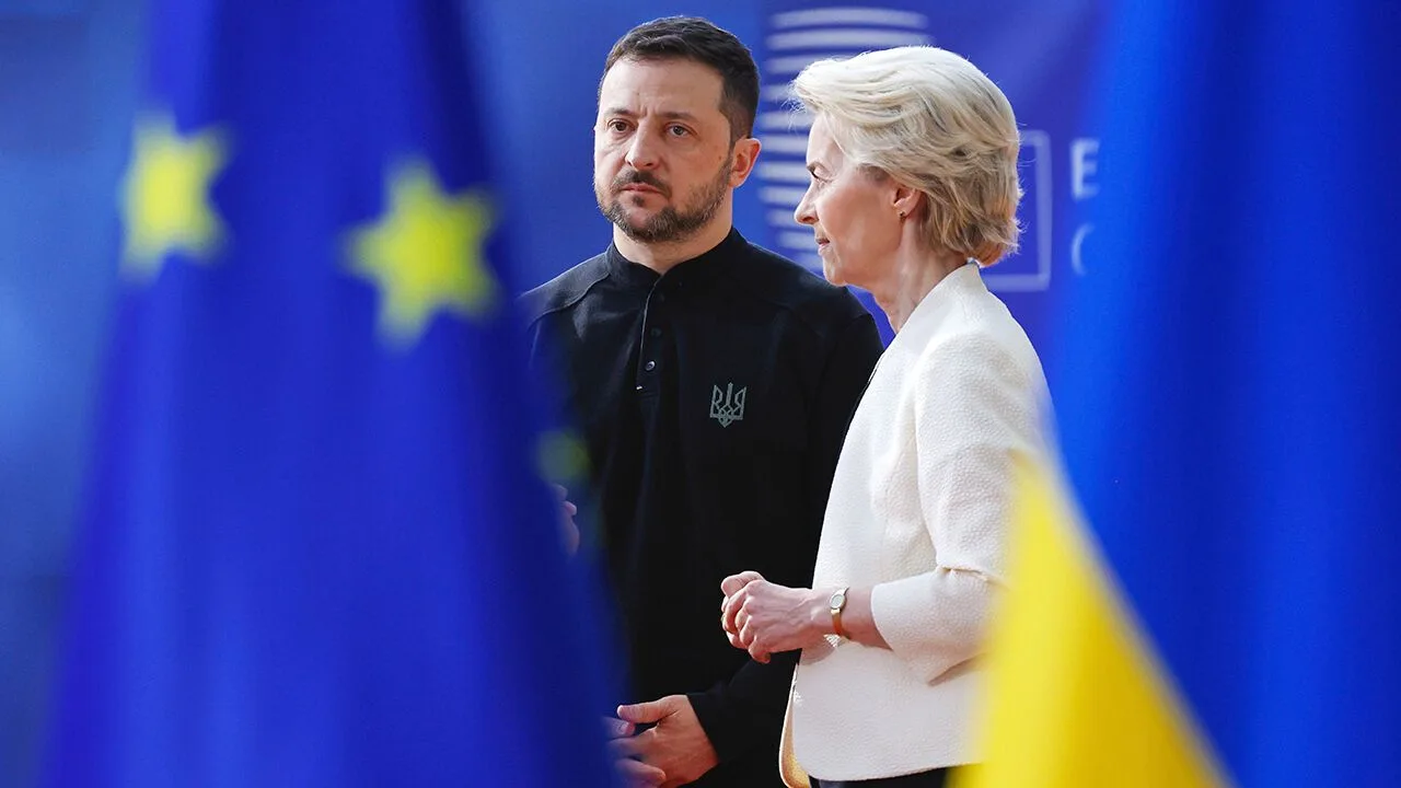 European Commission President Ursula von der Leyen speaks with Ukrainian President Volodymyr Zelensky at the European Council building in Brussels, Belgium