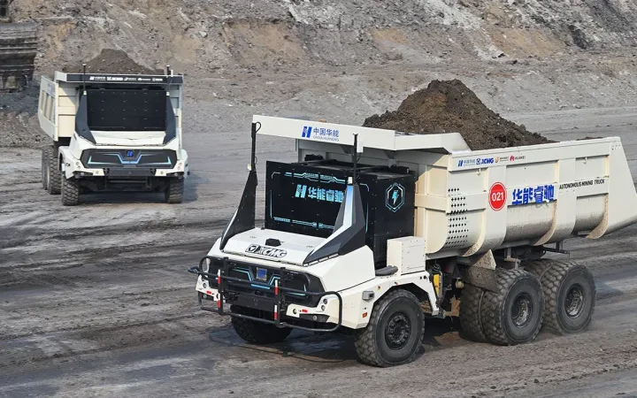 Autonomous haul trucks carrying overburden at China's Yimin coal mine