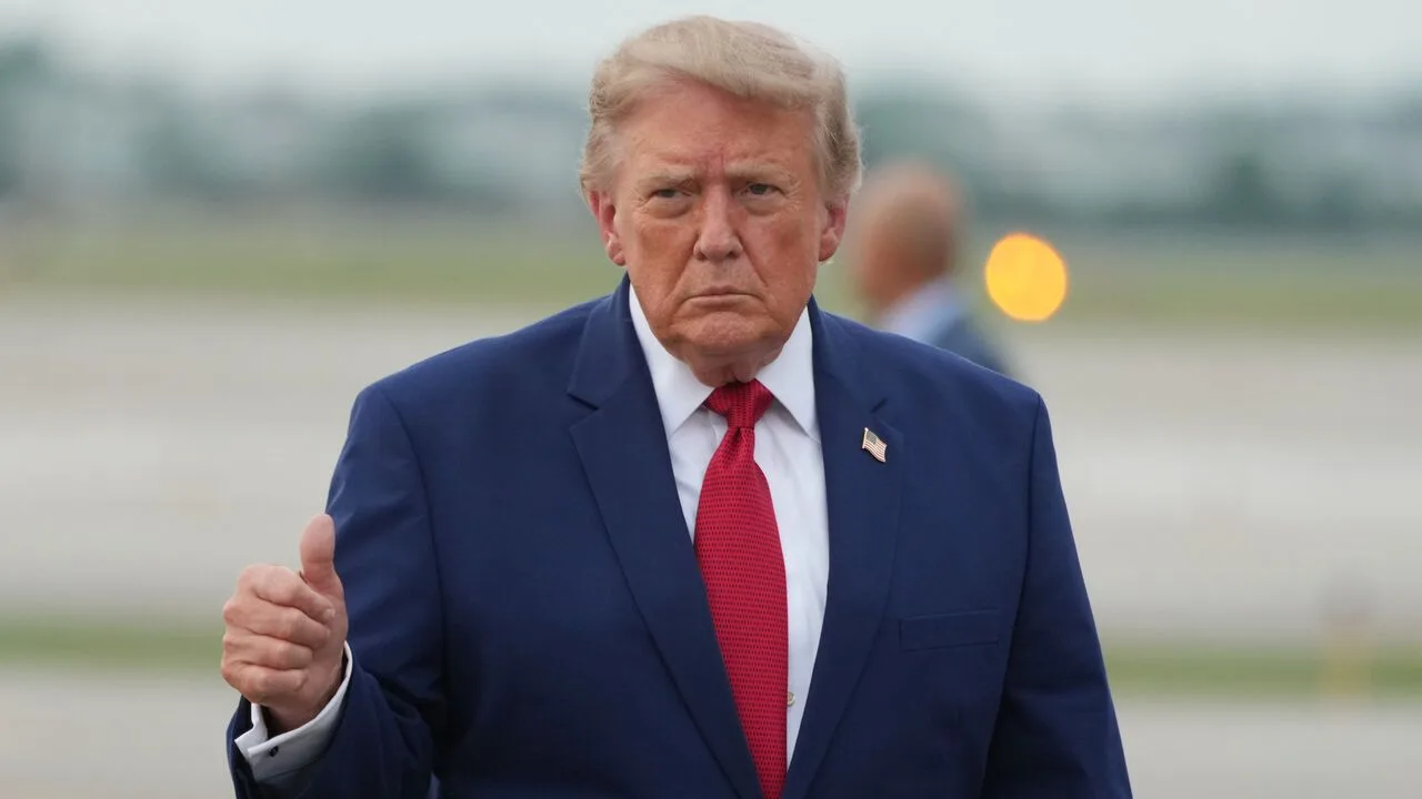 President Donald Trump gives a thumbs-up sign