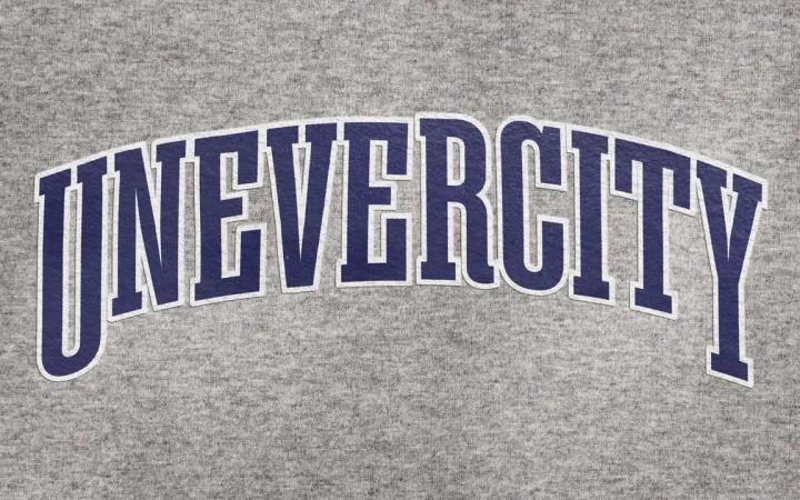 School jersey with "UNEVERCITY” on it.