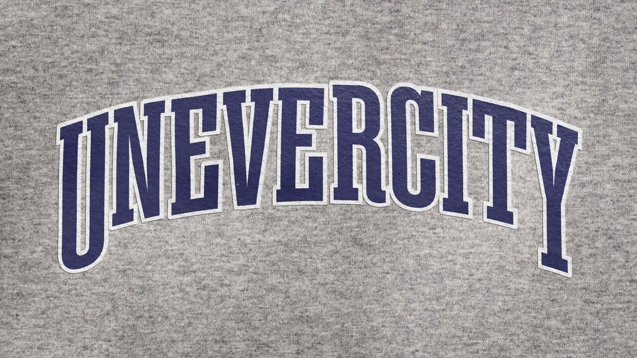 School jersey with “UNEVERCITY” on it.