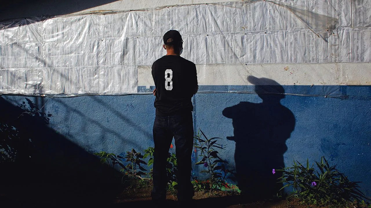 A man checks his name on the electoral roll during an election in Nicaragua