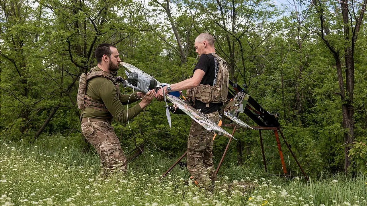 Ukrainian soldiers prepare a Bliskavka attack drone for a strike toward Kostiantynivka