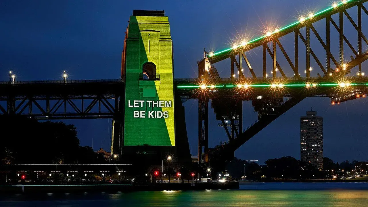 Sydney Harbour Bridge lit up to mark the start of Australia's under-16 social media restriction
