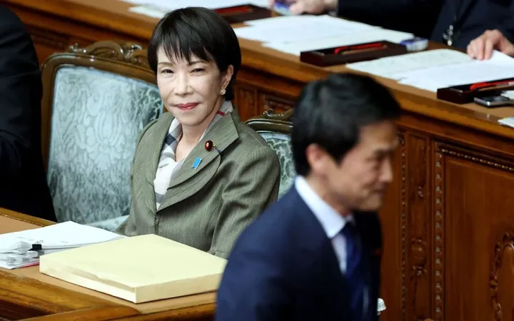 Japan Prime Minister Sanae Takaichi watches Centrist Reform Alliance chief Junya Ogawa at a special lower-house sitting in Tokyo