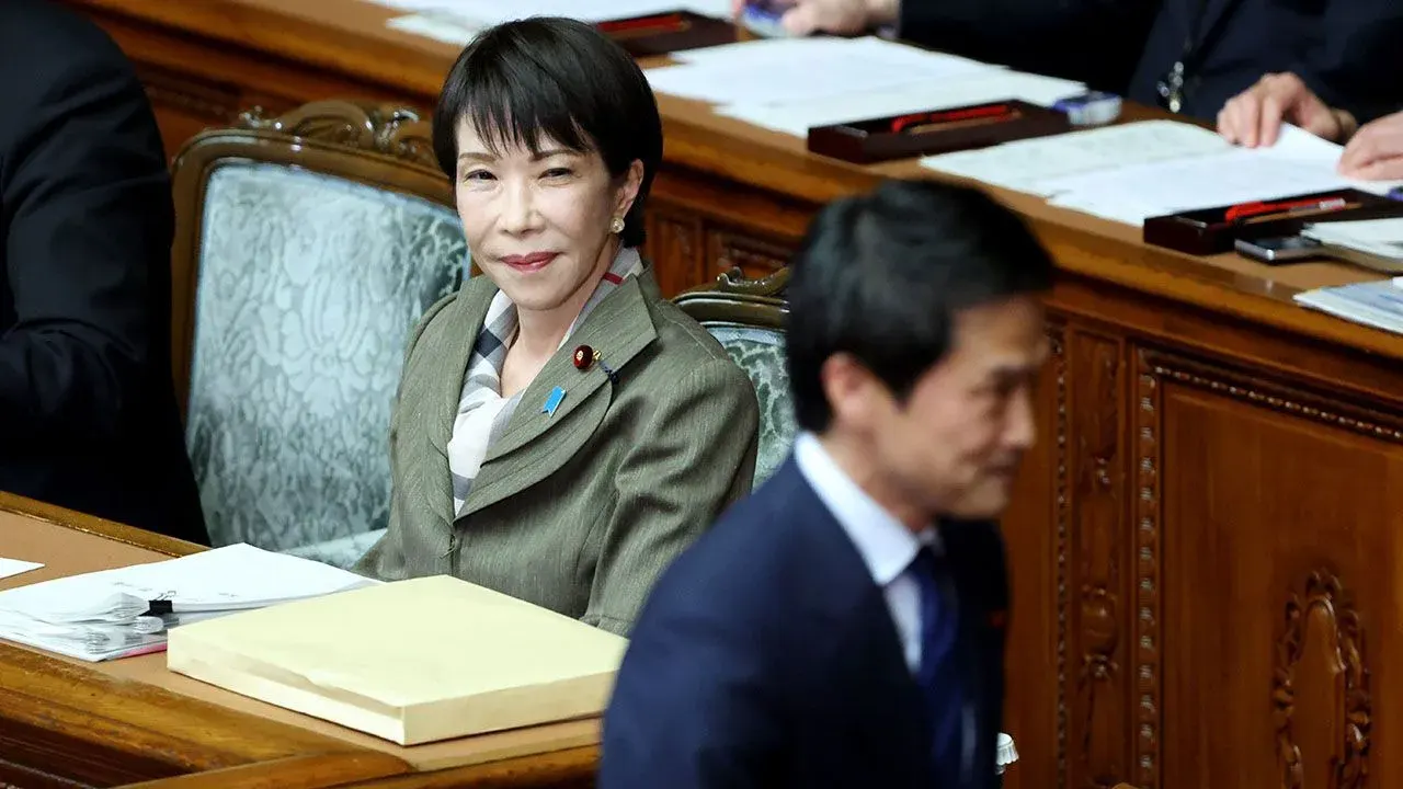 Japan Prime Minister Sanae Takaichi watches Centrist Reform Alliance chief Junya Ogawa at a special lower-house sitting in Tokyo