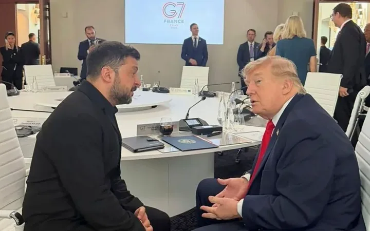 Volodymyr Zelensky and Donald Trump in conversation at the Evian G7 summit in France on June 16th 2026