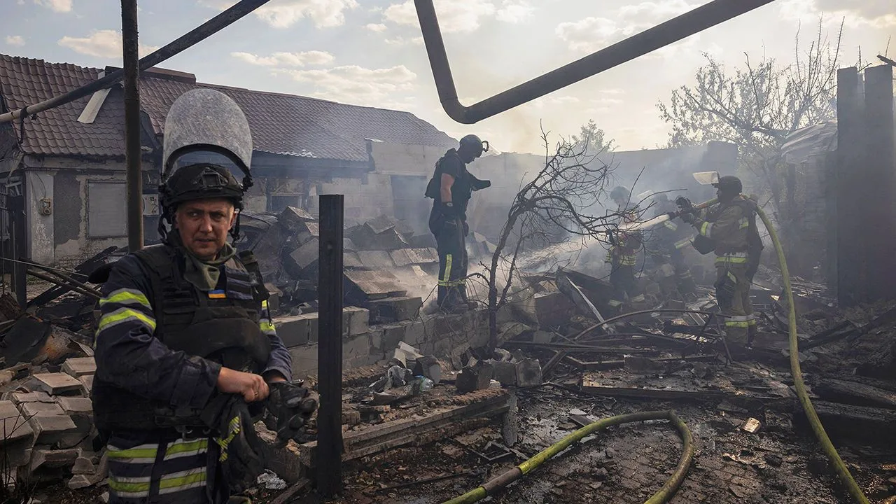 Emergency workers extinguish a fire that destroyed a private house after a Russian strike in Pokrovsk