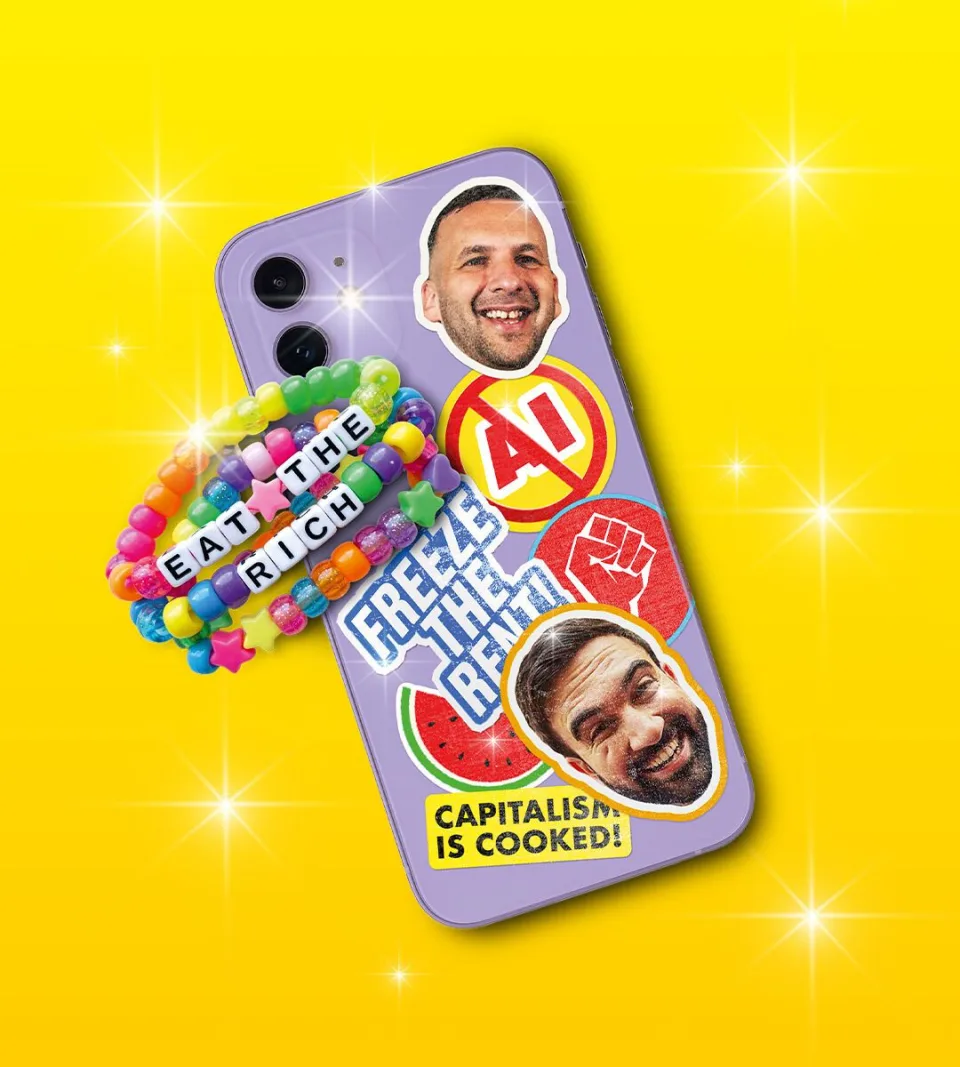 Phone case with stickers reading "Capitalism is Cooked" and "Eat the Rich" on yellow background.