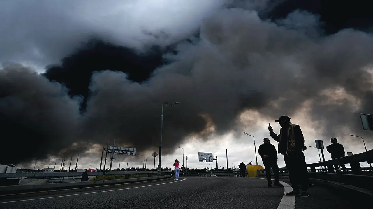 Dark smoke billowing from a Russian refinery fire after a reported strike as crews battle the blaze