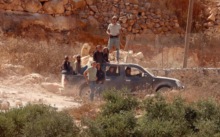 Israeli settlers besiege a Palestinian home in Qusra, Nablus