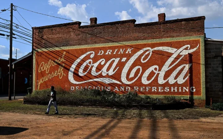 Vintage painted Coca-Cola advert on old brick building in Plains, Georgia