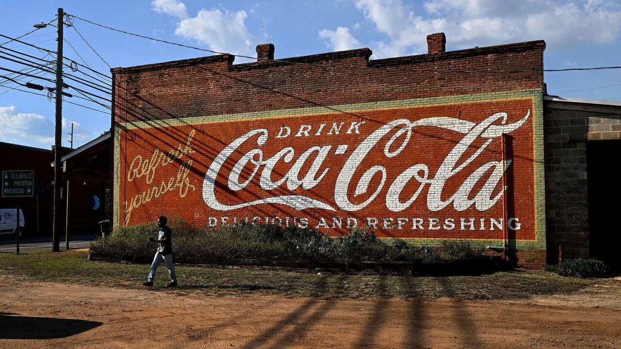 Vintage painted Coca-Cola advert on old brick building in Plains, Georgia