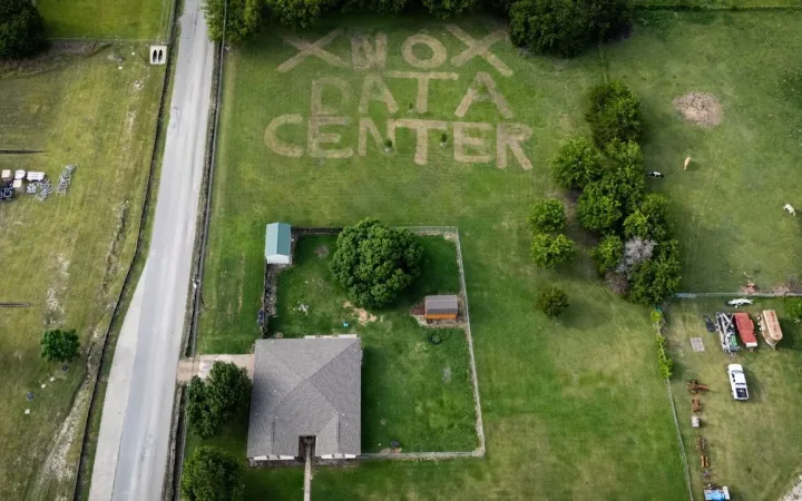 A home in Texas with opposition to nearby data center project mowed into lawn
