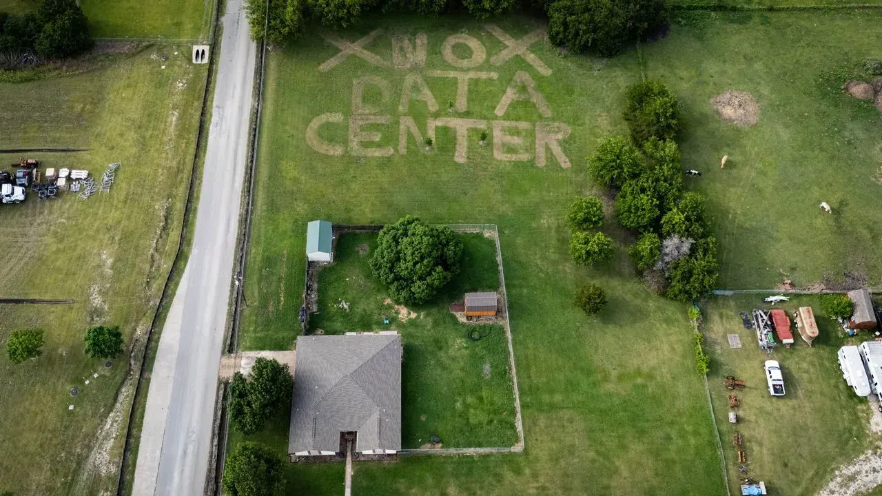 A home in Texas with opposition to nearby data center project mowed into lawn